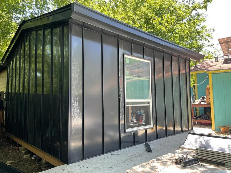 Black standing seam metal wall panels for Roof Inspection in Elon